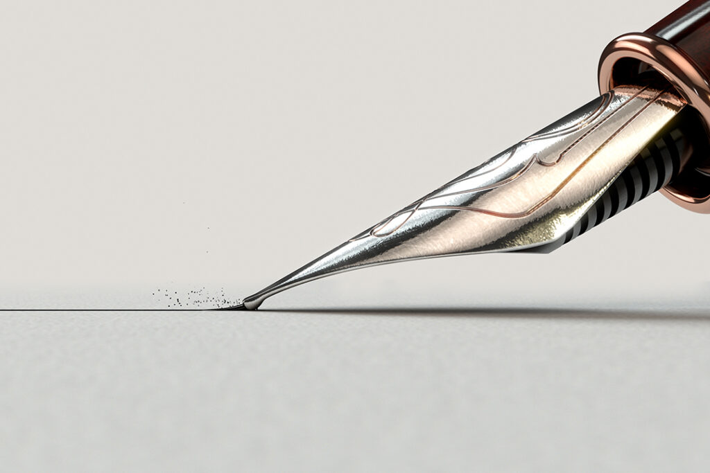 En närbild av en utsmyckad metallspets av en gammal reservoarpenna
